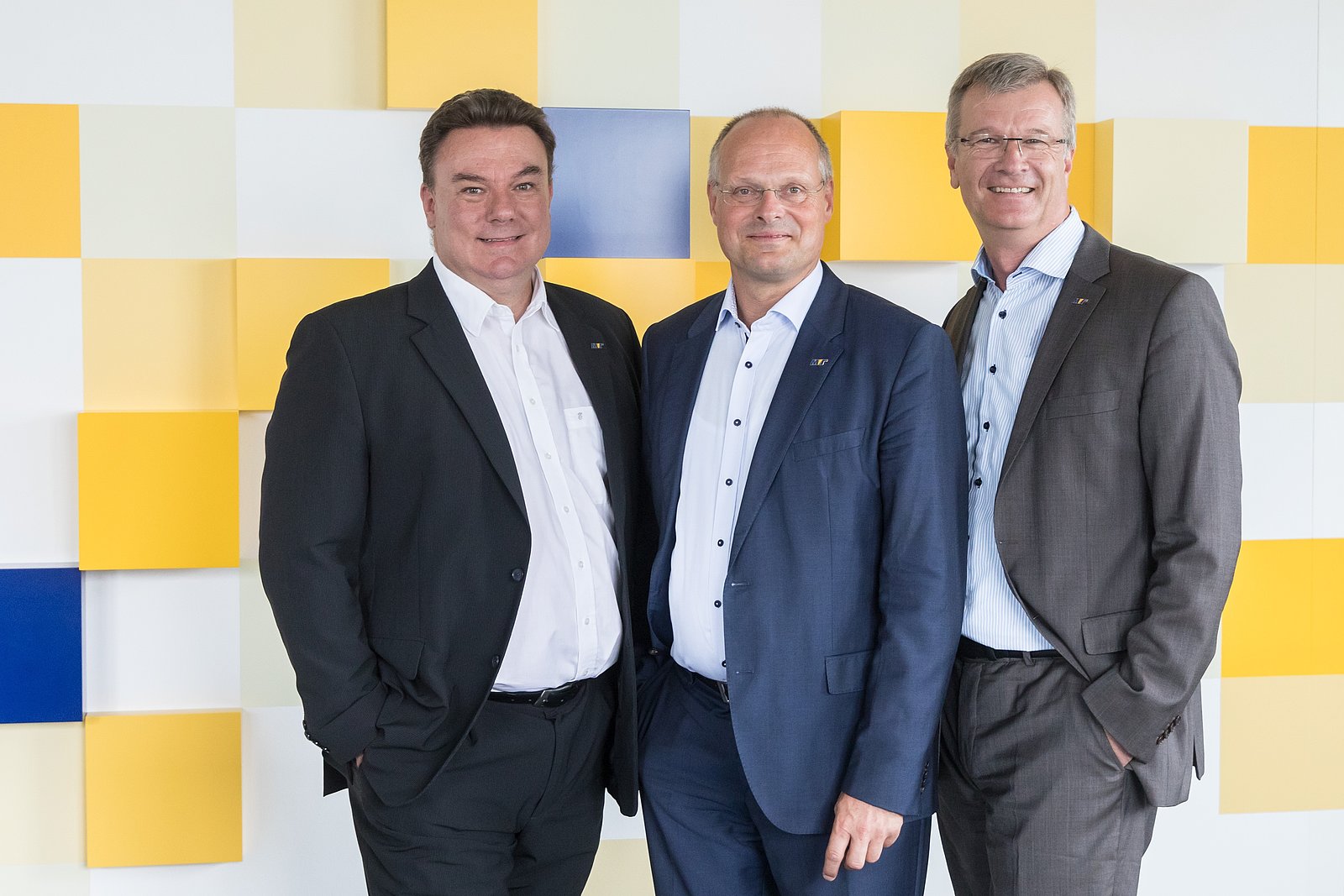 The three MVTec company founders and owners in dark suits